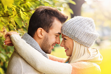 Wall Mural - Young lovely couple in the park in autumn