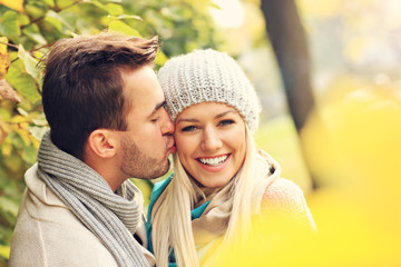 Sticker - Young lovely couple in the park in autumn