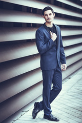 Wall Mural - Handsome man, model of fashion, wearing modern suit.