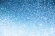 Leinwandbild Motiv Blue bokeh winter snowy christmas abstract background