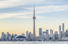 Toronto Skyline With The CN Tower Apex At Sunset.