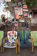 Multi-colored chairs with humorous signs, Route 66, Seligman, Arizona.