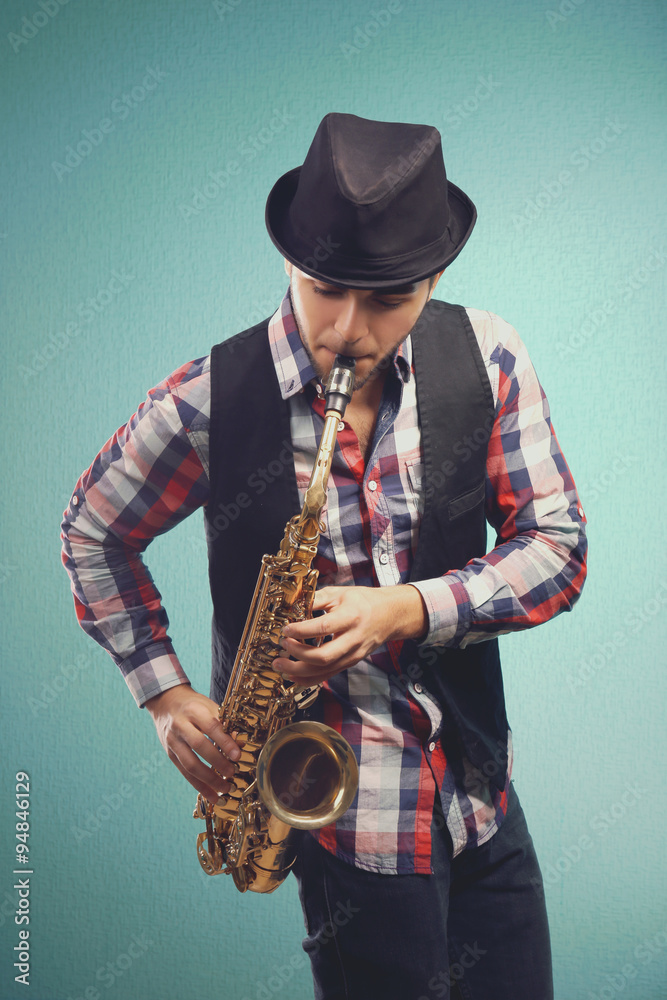 Saxophone player on blue background