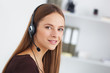 © Dmytro Panchenko - Portrait of happy young support phone operator with headset.
