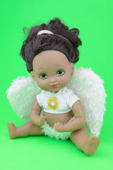 black skin doll wearing angel suit and wings, girl