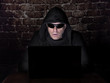 © fresnel6 - Hacker, trying to breach the security of a computer system