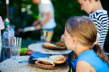 Canvas Print - Little girl eating burger