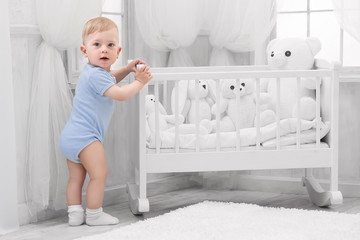 Portrait of a happy baby in the nursery