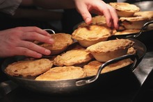 Chef Putting Pies Into Pans