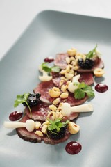 Wall Mural - beef carpaccio plated appetizer starter