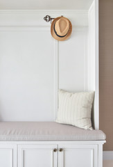 Wall Mural - Cozy seat with white frame with striped pillow and panama hat