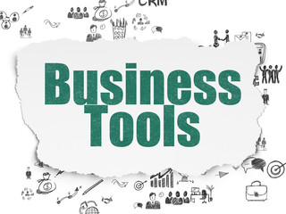 Finance concept: Business Tools on Torn Paper background