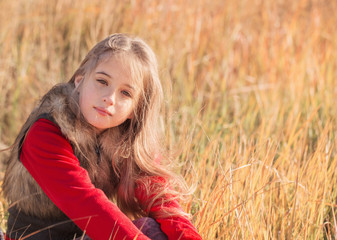 beautiful girl sitting on grass