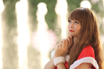 Portrait of beautiful Asian female santa in Christmas