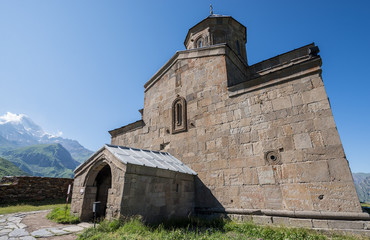 Sticker - 14th century Holy Trinity Church (Tsminda Sameba) near Mount Kazbek in Georgia