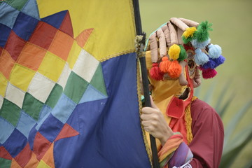 Man in mask celebrating solstice holiday. 
