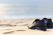 Black man leather shoe on the beach