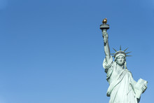 Statue Of Liberty Or Green Lady In New York City Seen From A Tourist Cruise. The Place Is A Major Tourist Landmark
