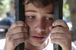 © fresnel6 - A child crying, behind a fence