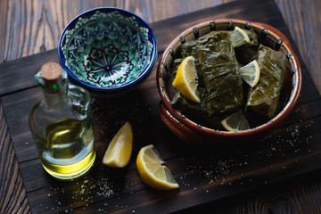 Wall Mural - Traditional eastern dolma served with lemon slices and olive oil