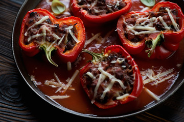 Poster - Stuffed bell peppers with tomato sauce and parmesan, close-up