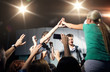 © Syda Productions - fan making high five with singer at club concert