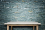 Fototapeta Desenie - Empty top of natural stone table and stone wall background