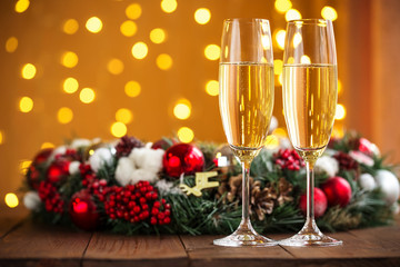 Two champagne glass on christmas bokeh background