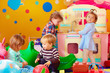 © Olesia Bilkei - cute little kids playing with toys in nursery group of kindergarten