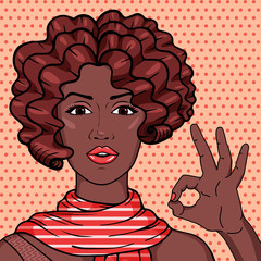 Vintage african american woman showing OK gesture pop art comic style illustration. Vector afro girl with brown curly hair in scarf.