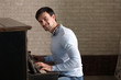 © Africa Studio - Handsome man plays piano in the class