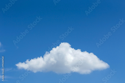 Obraz w ramie single cloud on clear blue sky background