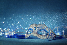 Blue Female Carnival Mask And Glitter Background. With Glitter Overlay
