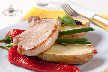 Sticker - Roasted pork chop with  potato and red peppers