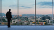 © Robert Kneschke - Business Manager looking at Los Angeles from office