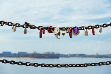 Locked locks of love on the iron chain