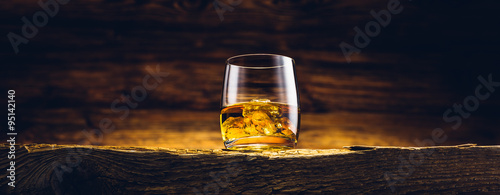 Fotomural Whiskey glass on the old wooden table