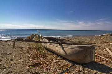 Wall Mural - Canoe at a tropical beach in East Timor