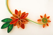 Paper flower on a greeting card close-up made with quilling tech