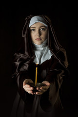 Canvas Print - Nun holding candle.