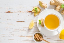 Ginger Tea And Ingredients On White Wood Background