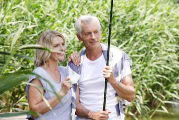 Wall Mural - Senior couple relaxing outdoor