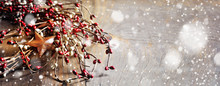 Christmas Wreath With Berries And Rusty Stars On Wooden Background. Long Format, Toned Image