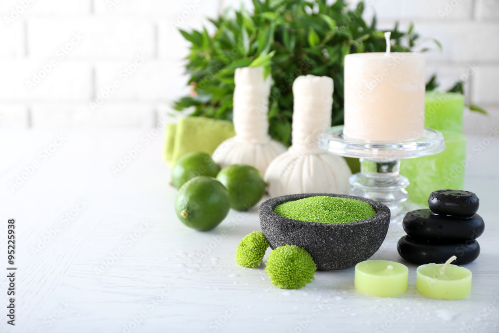 Beautiful composition of spa treatment on white wooden table