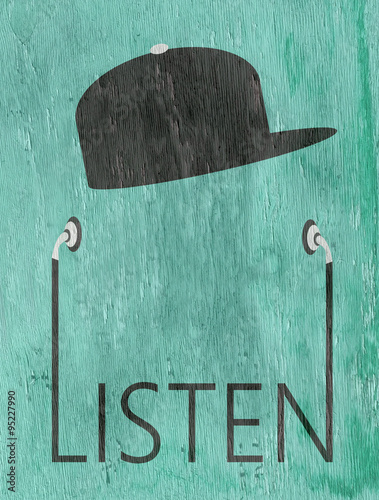 Valokuva youth with baseball cap listening to earphones