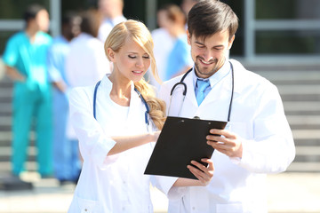 Canvas Print - Medical concept - two doctors with stethoscopes and prescription clipboard