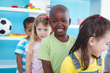 Wall Mural - Happy kids standing in a line