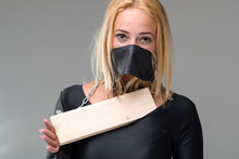 Woman With Mask Over Her Mouth