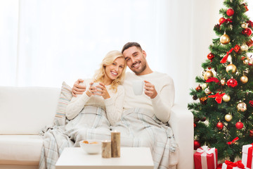 Canvas Print - happy couple at home with christmas tree