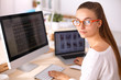 © shefkate - Young woman working in office, sitting at desk